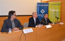 Foto de la conferència sobre la reforma horària a l'antic hospital amb l'alcalde Carles Pellicer al centre de la imatge